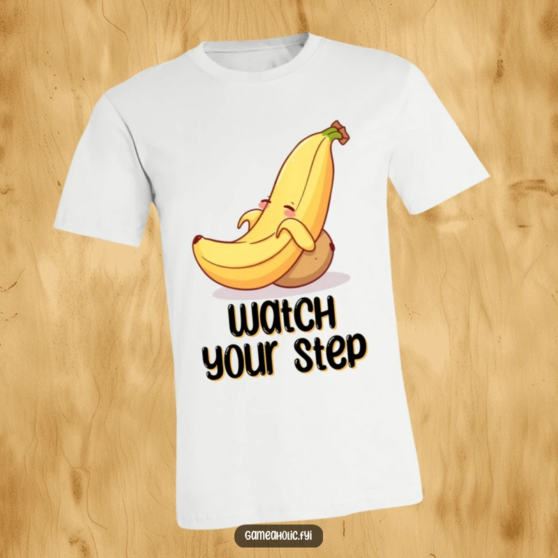 Funny t-shirt print of a grinning banana peel strategically placed to trip a drowsy, rolling potato.